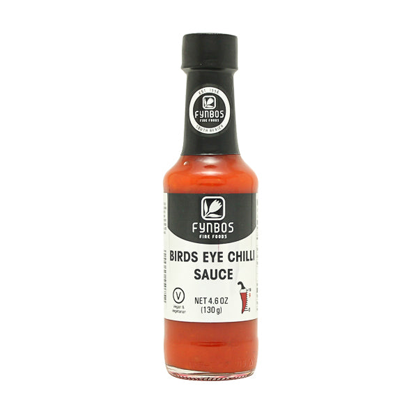 Fynbos African Bird’s Eye Chilli Sauce in a glass bottle, vibrant red, spicy South African condiment perfect for meats and vegetables