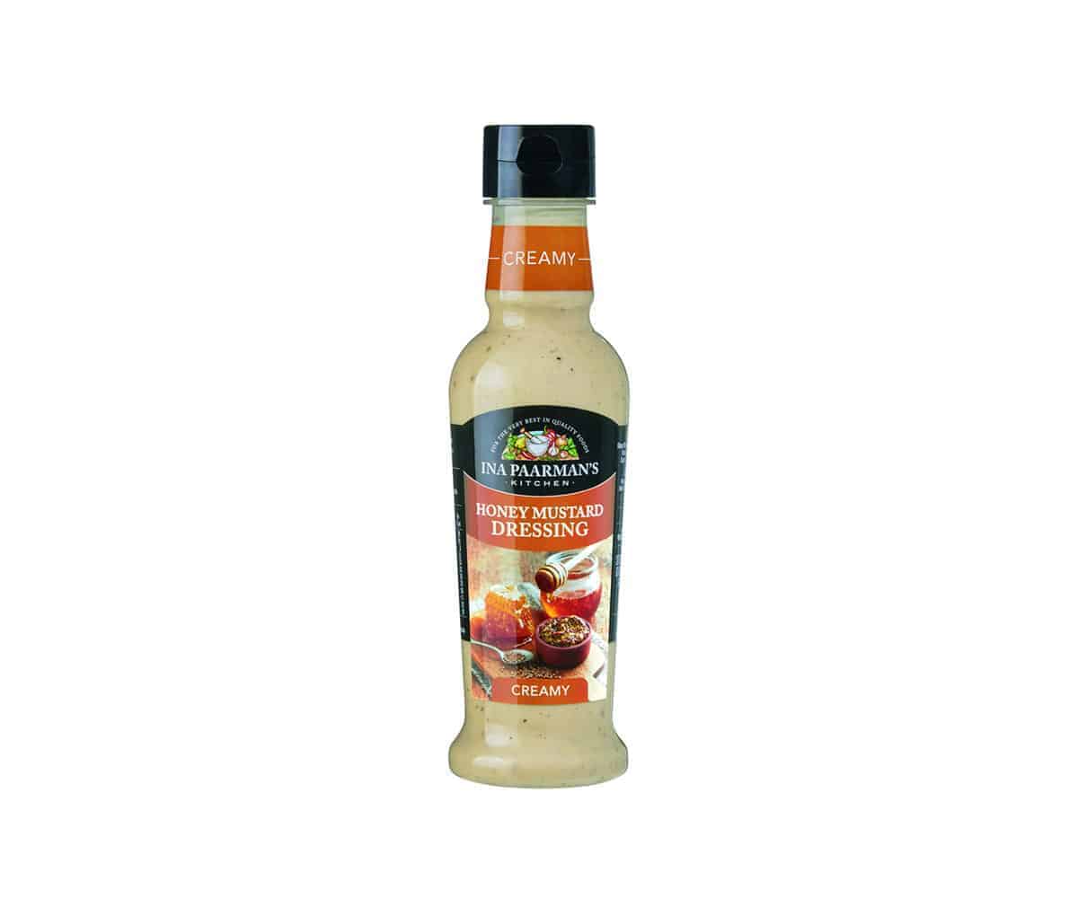 Bottle of Ina Paarman Honey Mustard Salad Dressing, smooth sweet and tangy South African dressing for salads and dips